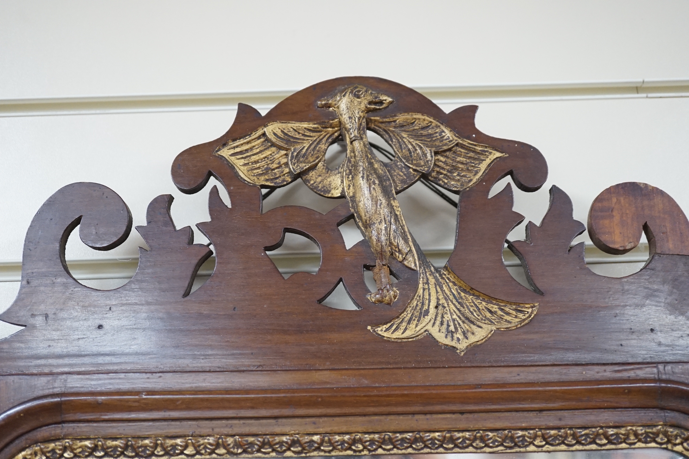 Two George III style inlaid mahogany fret cut wall mirrors, larger width 52cm, height 90cm